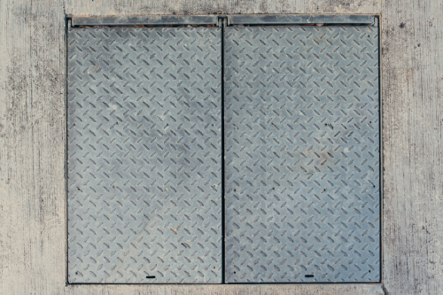 Embossed stamping on metal surfaces, creating detailed patterns and textures.