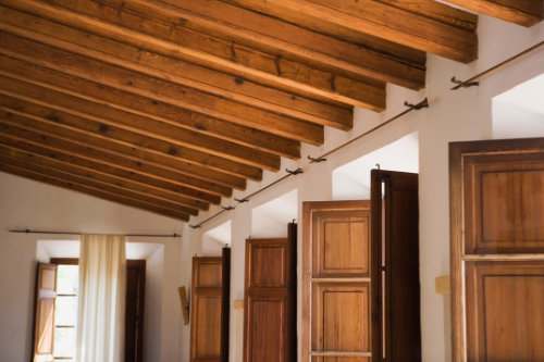 Exposed wooden ceiling beams adding rustic charm and architectural interest to the room
