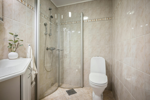 Modern bathroom design featuring sleek fixtures, glass shower, and minimalist decor