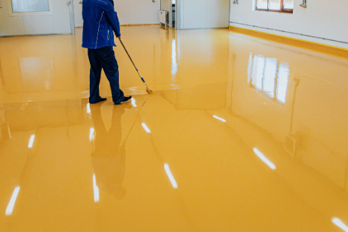 Epoxy flooring installation providing a durable, high-performance surface ideal for high-traffic areas and industrial spaces