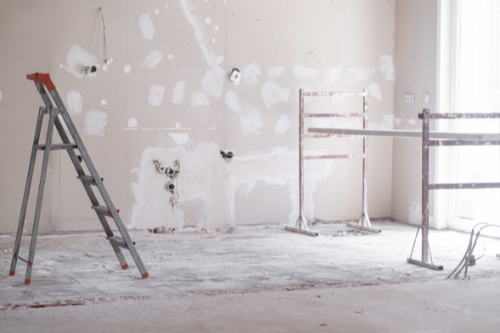 Drywall repair to restore smooth, even surfaces, fixing cracks, holes, and imperfections for a flawless finish